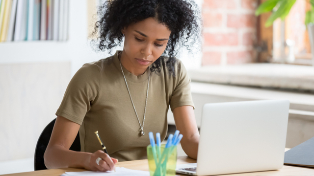 Woman filling out form to choose super fund