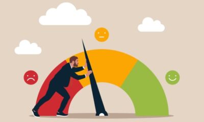 An animation of a businessman pushing a needle from an unhappy face to happy face.