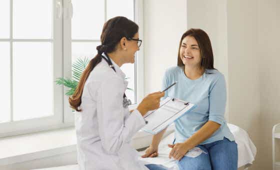 Doctor,Discussing,Treatment,With,Cheerful,Smiley,Female,Patient.,Happy,Physician