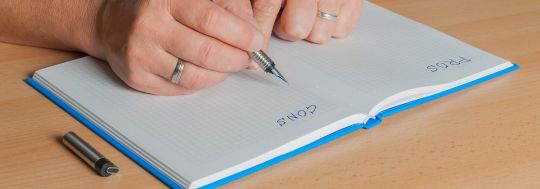 Writing down pros and cons | Canstar