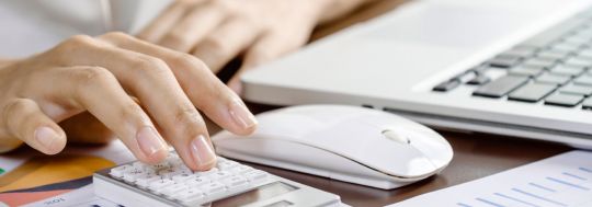 Woman Using Calculator