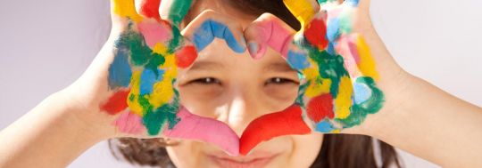 Young girl with paint on her hands | Canstar
