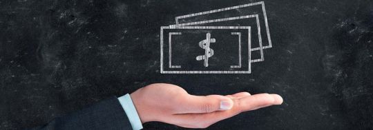 Blackboard with money signs
