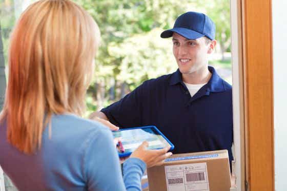 Courier delivering parcel