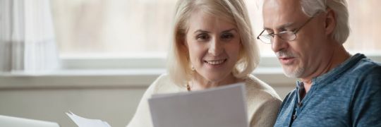 An elderly couple examing their account-based pension