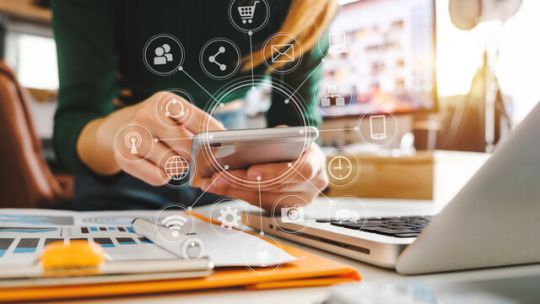 Concept image of a woman using a mobile phone for banking