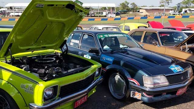Some classic cars on show at a race event in Darwin