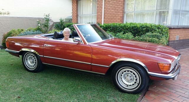 Irene Garrett in a 1975 Mercedes Benz 450SL Roadster