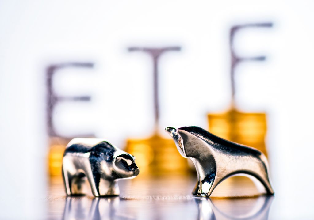 Bull and Bear figures with ETF label in background 