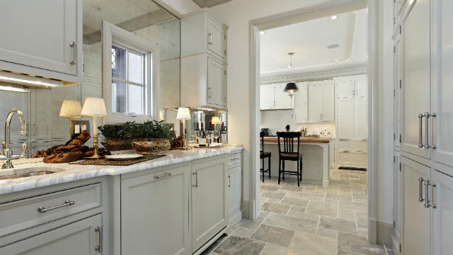 View from a butler's pantry looking out to the kitchen.