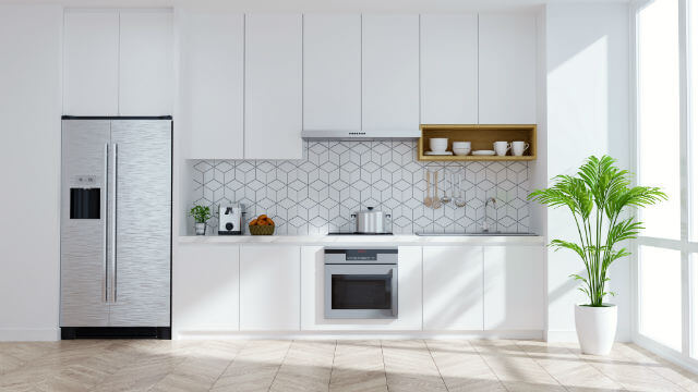 Geometric tiles add life to this otherwise plain kitchen.