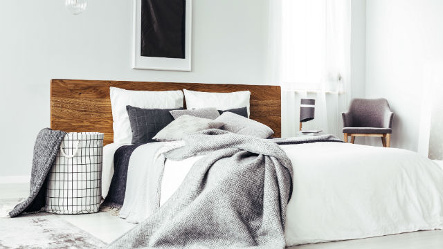 A throw rug on a bed.