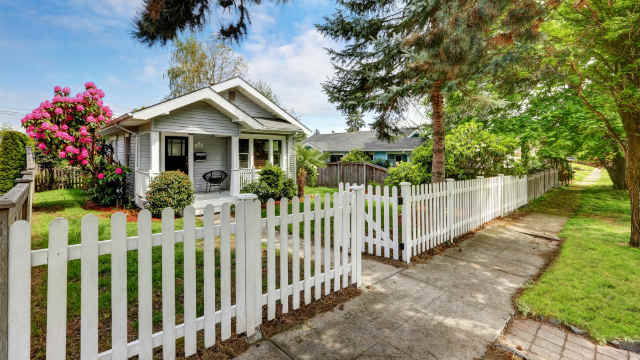 A house wit a white picket fence