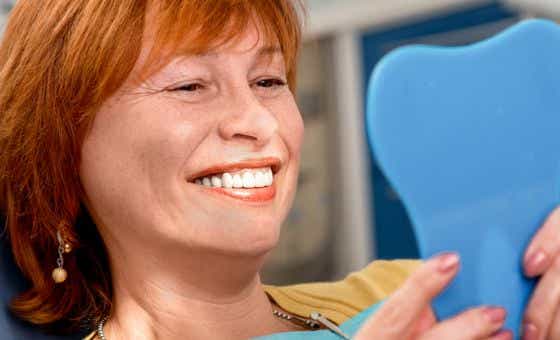 Woman smiling in a dentist office