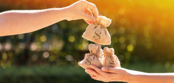 People holding money bags | Canstar