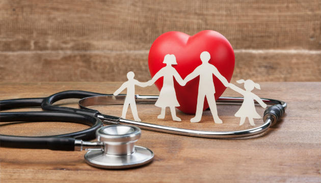 An image of a cutout family in front of a heart, with a stethoscope | Canstar