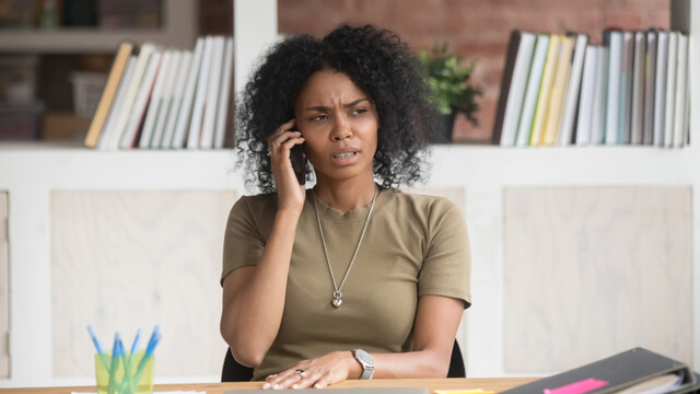 woman on phone to bank | Canstar