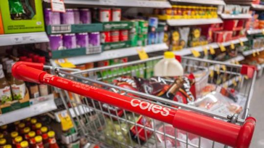 Coles shopping trolley parked in an aisle
