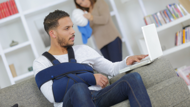 Injured man with laptop