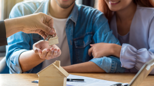 Couple receiving house keys