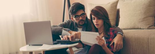 Couple Looking at Bills