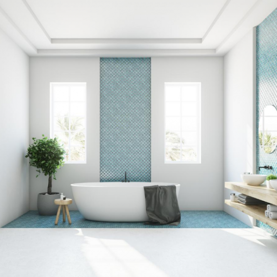 A renovated bathroom with aqua tile insert