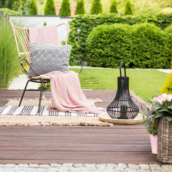 A deck dressed with a comfy chair