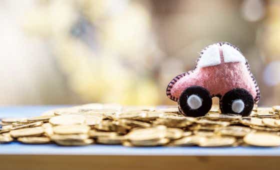 model pink car on coins