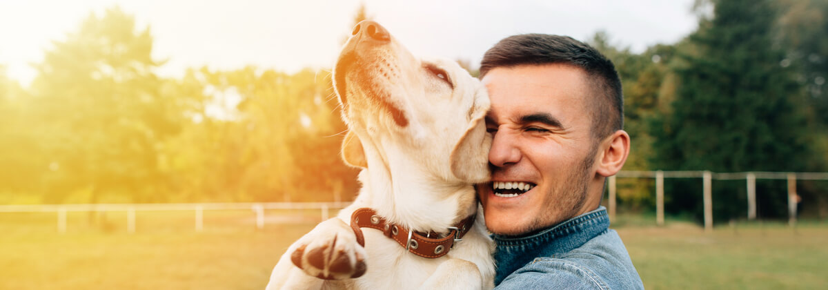pet owner holding his dog