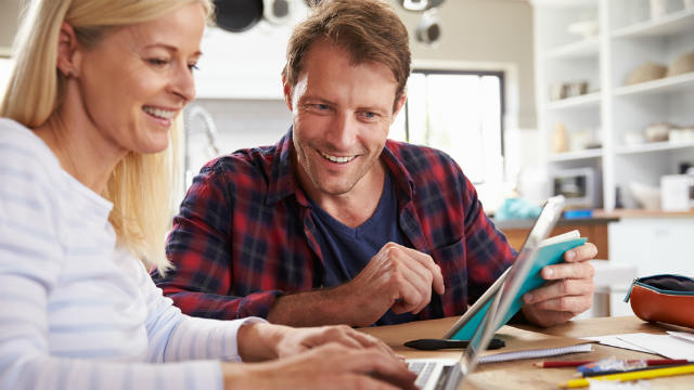 Couple looking at laptop