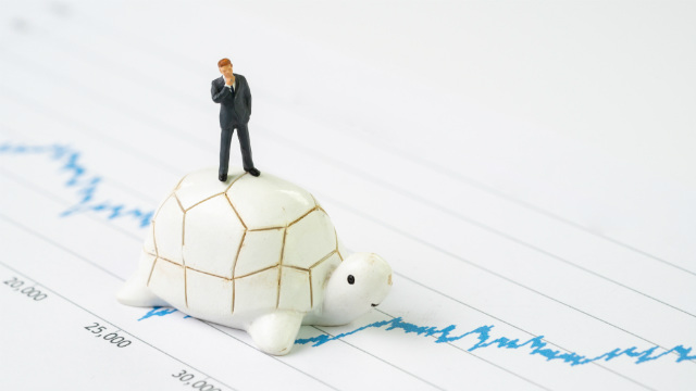 Man on snail investing slowly