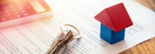 house keys on signed home loan contract