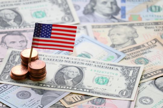 American coins, bank notes and small flag