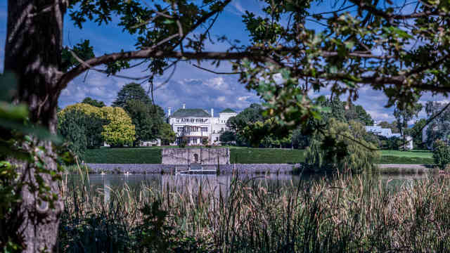 View across the lake in Canberra to the Governor General's Lodge.
