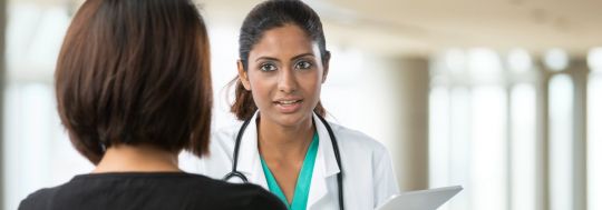 Doctor speaking with family