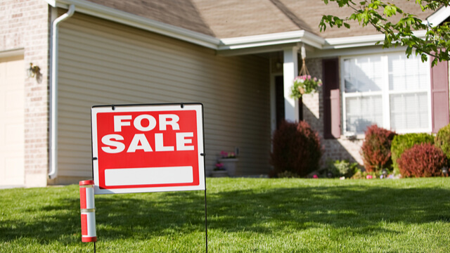 For sale sign at the front of a home