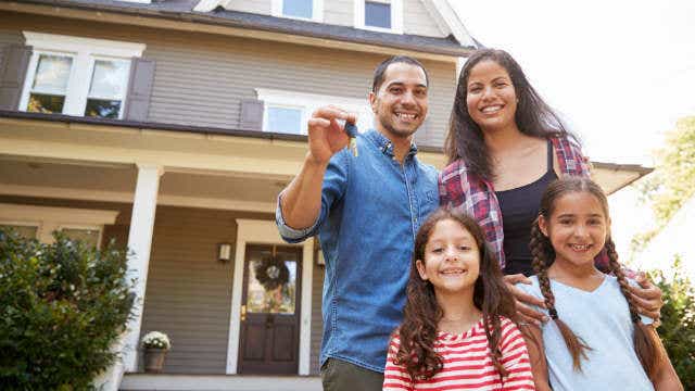 Family with keys to house