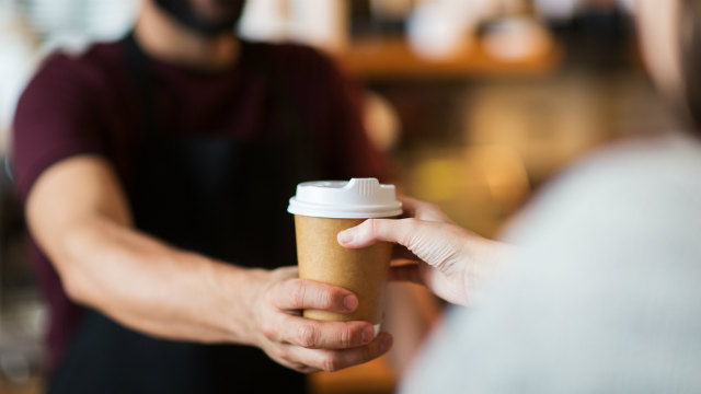 Person being given coffee
