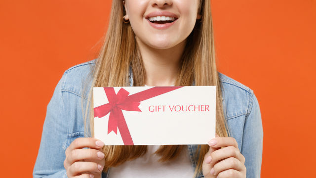 Woman with gift voucher