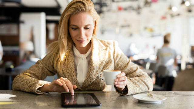 Woman researching on tablet