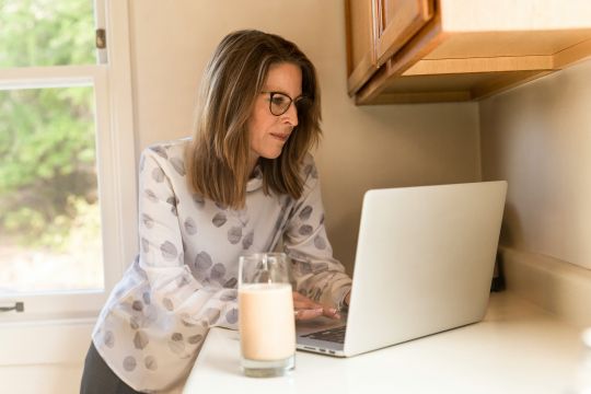 Middle aged woman on laptop