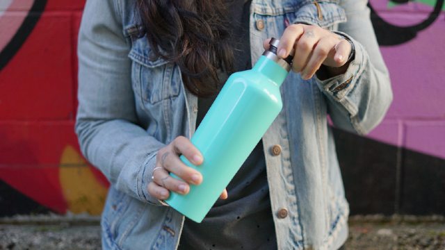 Person with reusable water bottle