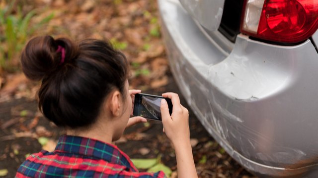 taking photo of damaged car 