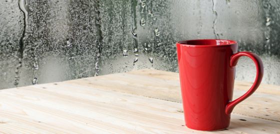 Coffee cup with rain