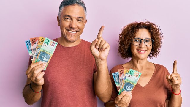 Couple holding cash