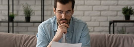 Man looking at paperwork