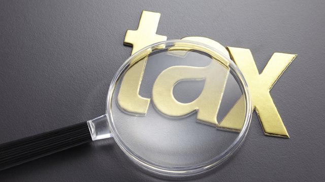 Tax under magnifying glass