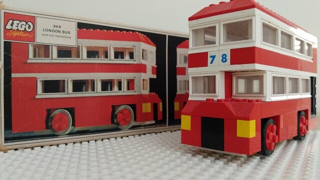 The LEGO London Bus next to its battered box.