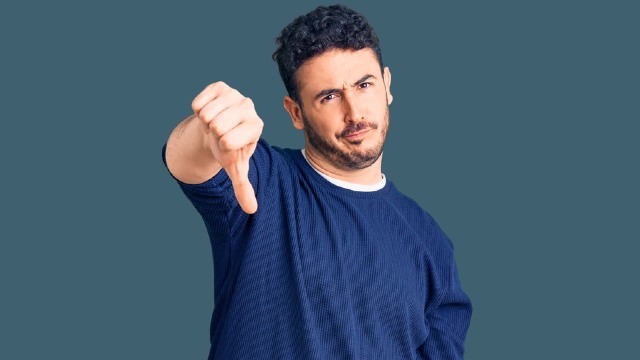 Man with thumbs down