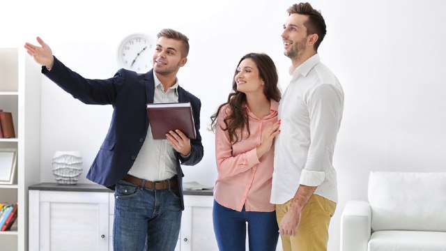 Couple talking to agent